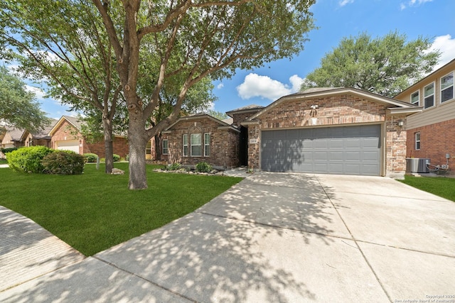 13014 Essen, Helotes, TX 78023 - view of front of property featuring a garage, a front yard, driveway, cooling unit, and brick siding
