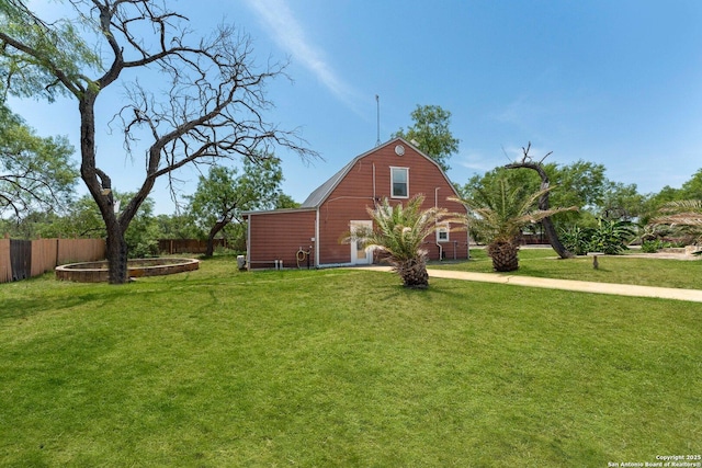 8608 S Foster Rd, San Antonio, TX 78222 - view of home's exterior with a barn, a gambrel roof, and an outdoor structure