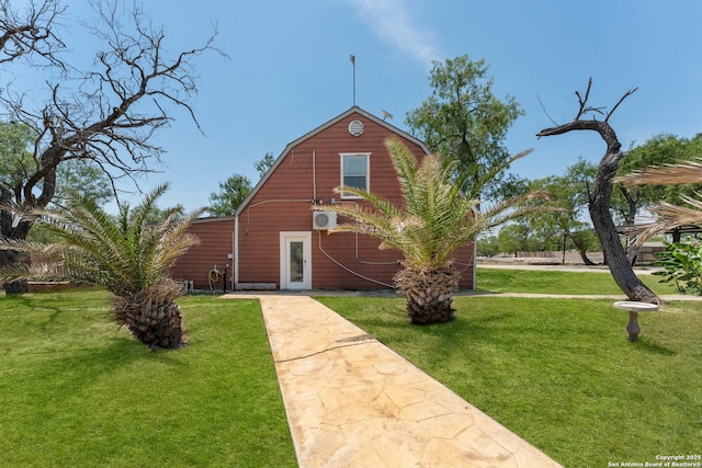 8608 S Foster Rd, San Antonio, TX 78222 - view of front of home with a barn, a front yard, a gambrel roof, and an outdoor structure