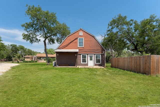 8608 S Foster Rd, San Antonio, TX 78222 - rear view of house with a gambrel roof and a patio