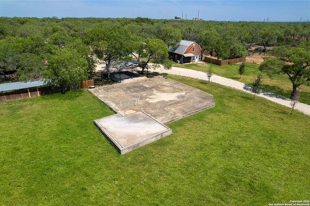 8608 S Foster Rd, San Antonio, TX 78222 - view of green lawn featuring a forest view