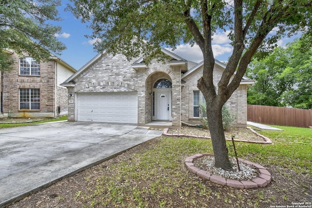 1947 Walter Raleigh, Windcrest, TX 78239 - traditional home with a garage, concrete driveway, and brick siding