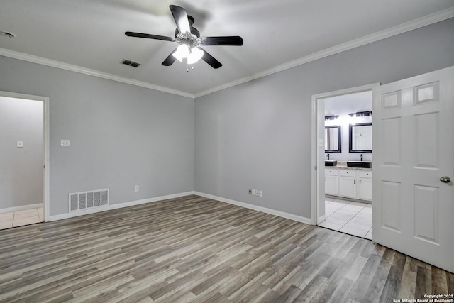 1947 Walter Raleigh, Windcrest, TX 78239 - spare room featuring ceiling fan, light wood finished floors, ornamental molding, and baseboards