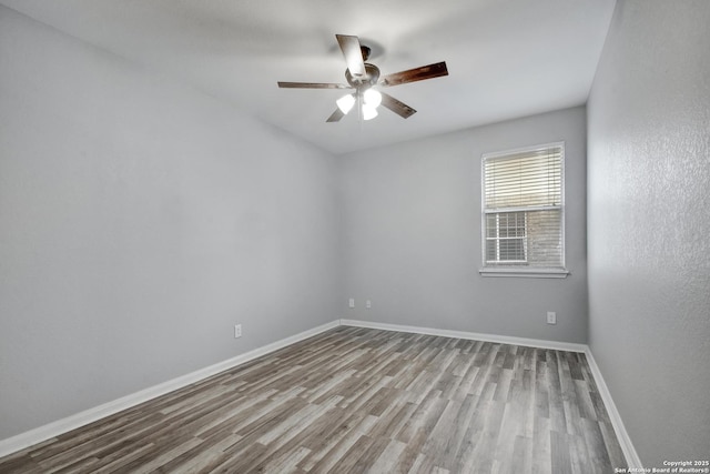 1947 Walter Raleigh, Windcrest, TX 78239 - spare room with wood finished floors, a ceiling fan, and baseboards