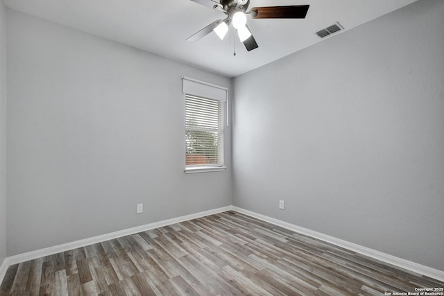 1947 Walter Raleigh, Windcrest, TX 78239 - empty room featuring wood finished floors, baseboards, and ceiling fan