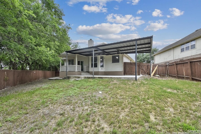 1947 Walter Raleigh, Windcrest, TX 78239 - back of house featuring a patio area and a chimney