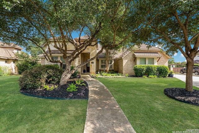 314 Regent Cir, Shavano Park, TX 78231 - view of front of property featuring a front yard, brick siding, and a tiled roof
