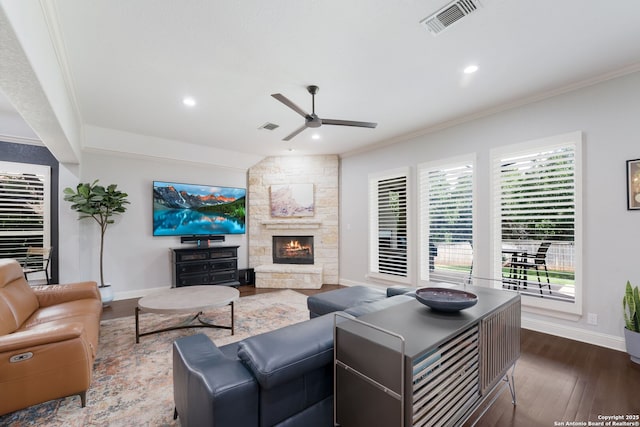 314 Regent Cir, Shavano Park, TX 78231 - living room with a ceiling fan, dark wood-style floors, ornamental molding, a stone fireplace, and baseboards