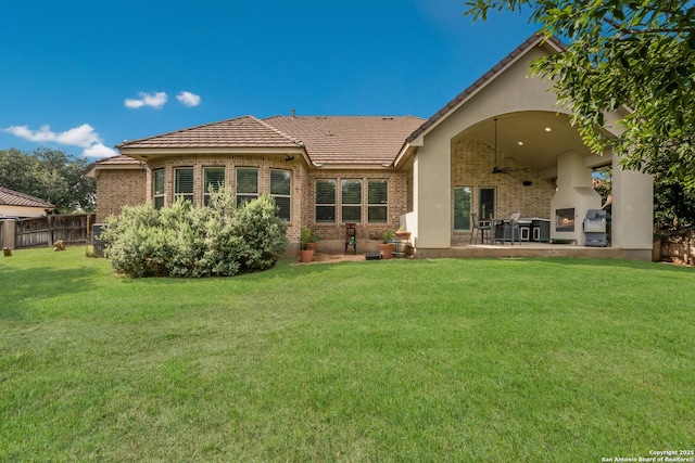 314 Regent Cir, Shavano Park, TX 78231 - back of property featuring brick siding, a patio area, a tile roof, and stucco siding