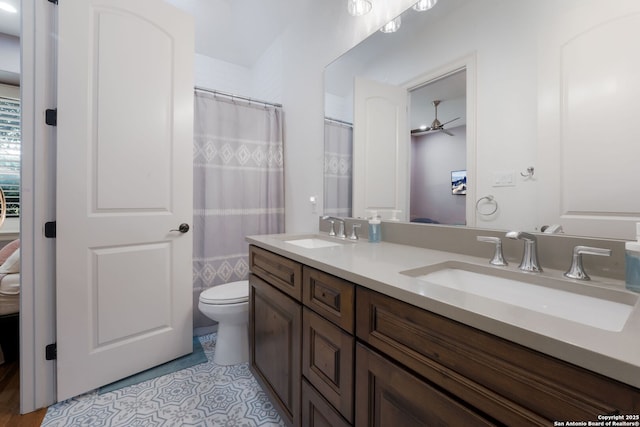 314 Regent Cir, Shavano Park, TX 78231 - ensuite bathroom featuring double vanity, tile patterned flooring, toilet, and ceiling fan