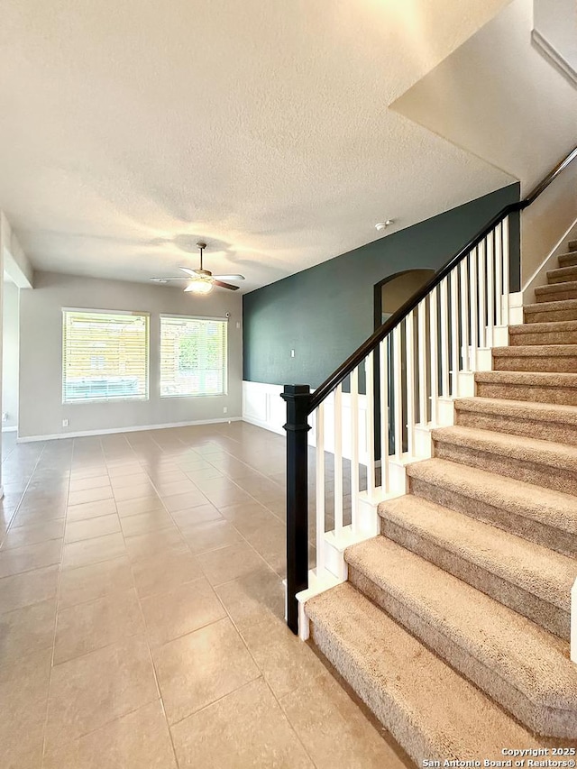 2035 Tillman Park, San Antonio, TX 78253 - staircase featuring ceiling fan, tile patterned floors, and a textured ceiling