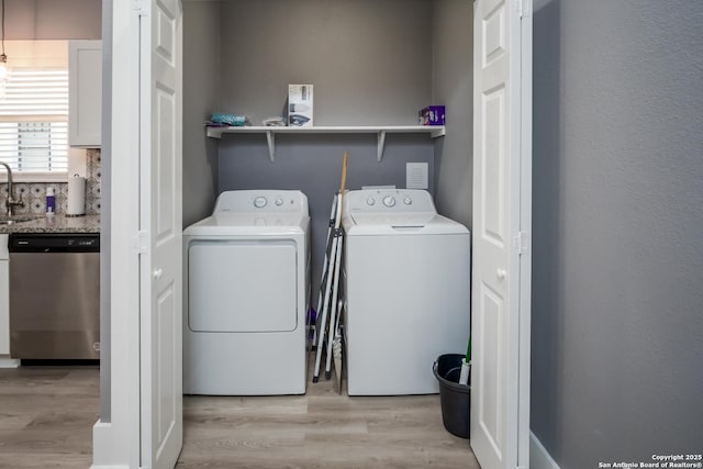 128 Blanco, San Antonio, TX 78212 - laundry room with separate washer and dryer and light wood-style flooring