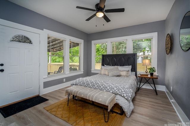 128 Blanco, San Antonio, TX 78212 - bedroom featuring baseboards, light wood-style flooring, and a ceiling fan