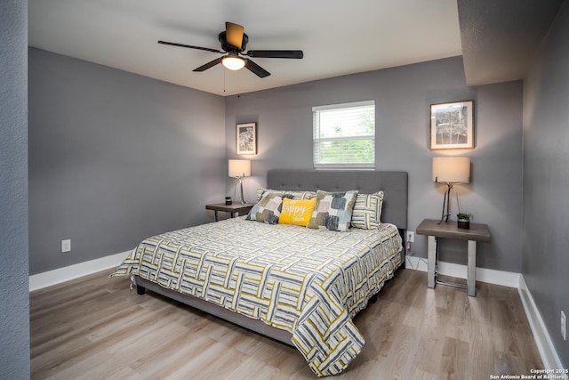 128 Blanco, San Antonio, TX 78212 - bedroom with wood finished floors, baseboards, and ceiling fan