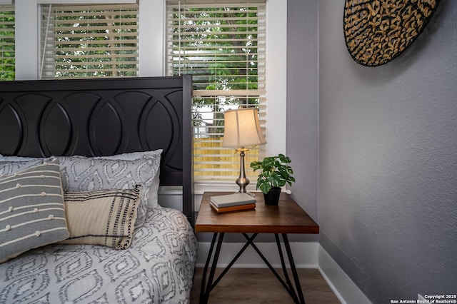 128 Blanco, San Antonio, TX 78212 - bedroom with baseboards, wood finished floors, and a textured wall