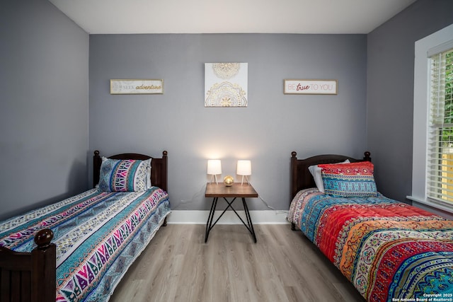 128 Blanco, San Antonio, TX 78212 - bedroom featuring wood finished floors and baseboards