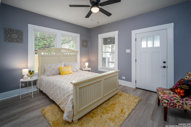 128 Blanco, San Antonio, TX 78212 - bedroom featuring wood finished floors, baseboards, and a ceiling fan