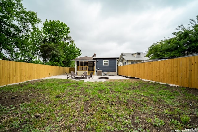 128 Blanco, San Antonio, TX 78212 - back of property with a patio, a sunroom, a fenced backyard, and a fire pit