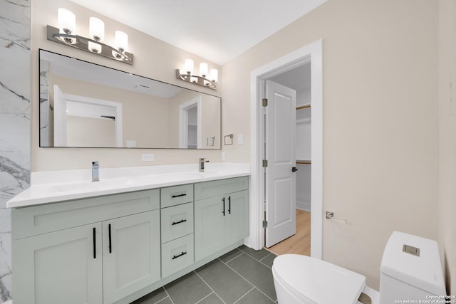 11710 Vance Jackson Rd Unit 801, San Antonio, TX 78230 - full bathroom featuring double vanity, tile patterned floors, and a walk in closet