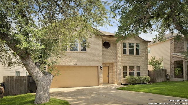17214 Irongate Rail, San Antonio, TX 78247 - traditional home featuring concrete driveway, a garage, and brick siding