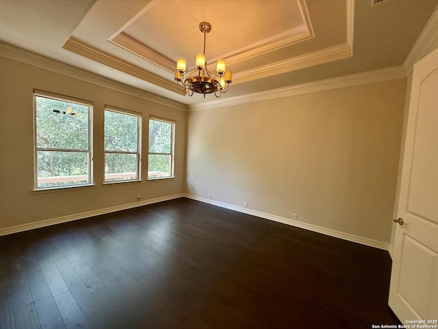 1410 Melanie, San Antonio, TX 78258 - empty room featuring a raised ceiling, a chandelier, dark wood-style flooring, baseboards, and ornamental molding