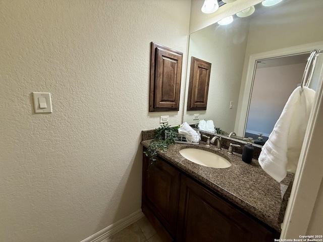 1410 Melanie, San Antonio, TX 78258 - bathroom with vanity, a textured wall, and tile patterned flooring