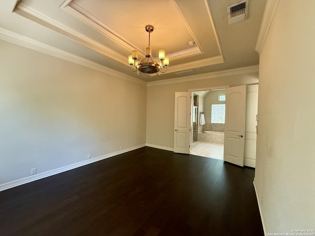 1410 Melanie, San Antonio, TX 78258 - empty room with a raised ceiling, a chandelier, dark wood-style flooring, crown molding, and baseboards