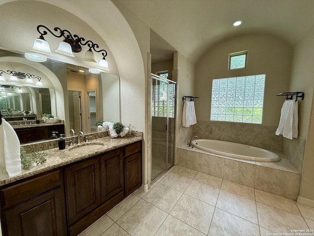 1410 Melanie, San Antonio, TX 78258 - bathroom with vanity, a garden tub, a stall shower, lofted ceiling, and tile patterned floors