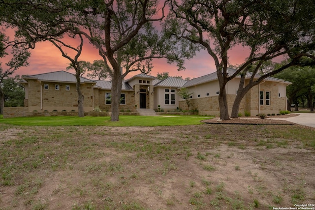 507 Arthur Ct, Spring Branch, TX 78070 - view of front facade featuring a standing seam roof, a front yard, stone siding, and metal roof