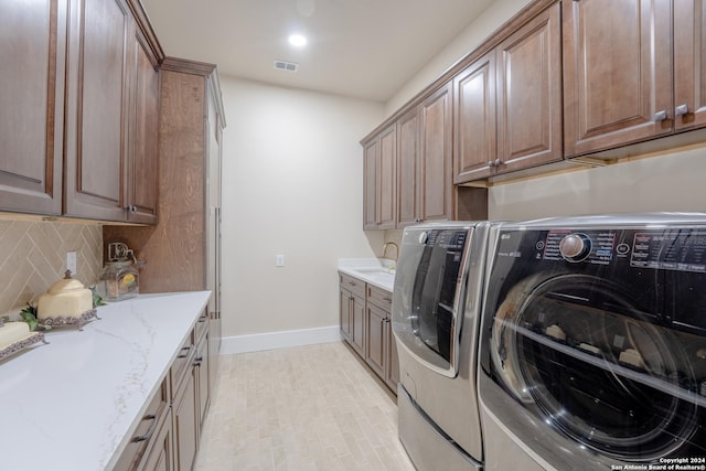 507 Arthur Ct, Spring Branch, TX 78070 - washroom with cabinet space, independent washer and dryer, and baseboards