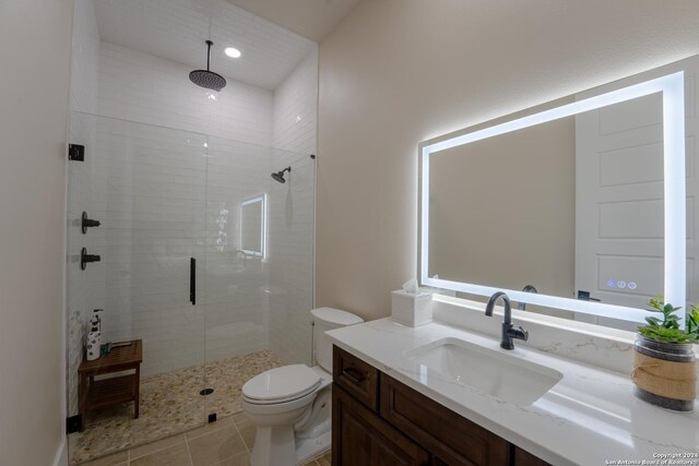 507 Arthur Ct, Spring Branch, TX 78070 - bathroom with a shower stall, vanity, toilet, tile patterned floors, and recessed lighting