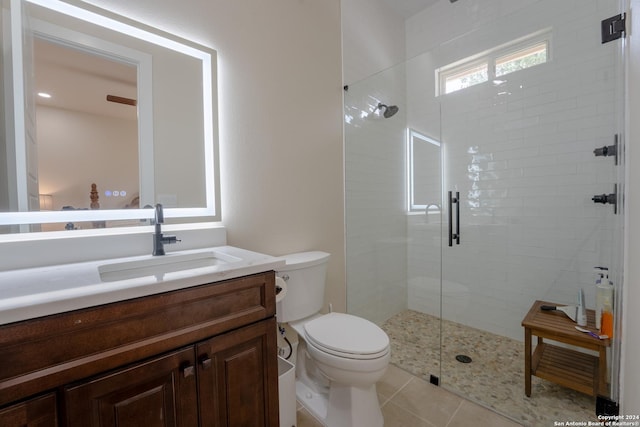 507 Arthur Ct, Spring Branch, TX 78070 - bathroom featuring toilet, a stall shower, vanity, and tile patterned floors