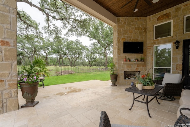 507 Arthur Ct, Spring Branch, TX 78070 - view of patio / terrace with an outdoor stone fireplace and a ceiling fan