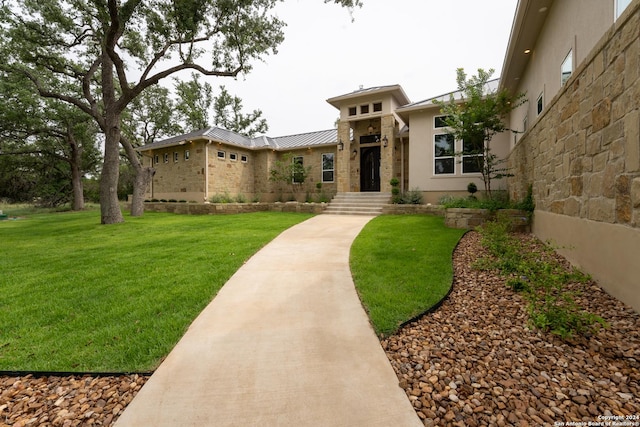 507 Arthur Ct, Spring Branch, TX 78070 - prairie-style home with stucco siding, a front lawn, metal roof, and a standing seam roof
