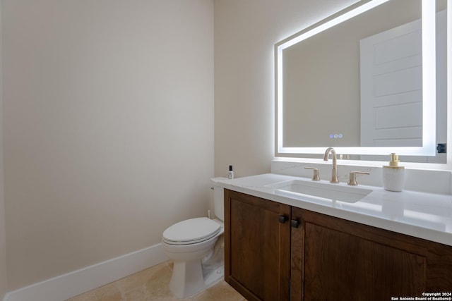 507 Arthur Ct, Spring Branch, TX 78070 - bathroom with vanity, toilet, baseboards, and tile patterned flooring