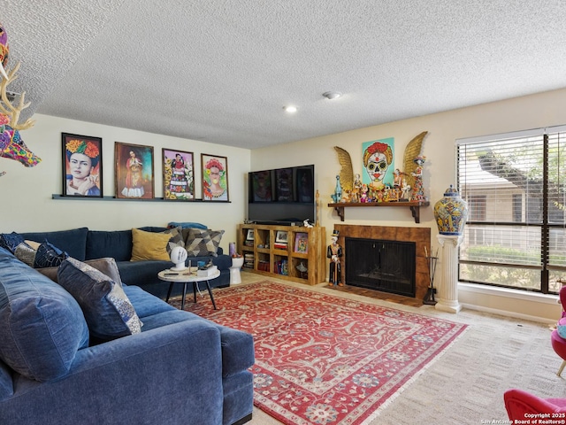 141 E Summit, San Antonio, TX 78212 - living room featuring a textured ceiling and a tiled fireplace