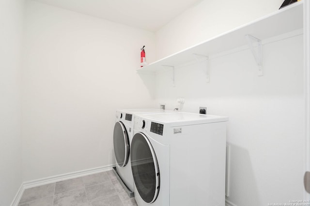 2006 Prometheus Cv, San Antonio, TX 78245 - washroom featuring washer and dryer and baseboards