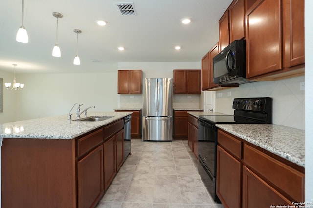 2006 Prometheus Cv, San Antonio, TX 78245 - kitchen with black appliances, a sink, tasteful backsplash, hanging light fixtures, and light stone countertops