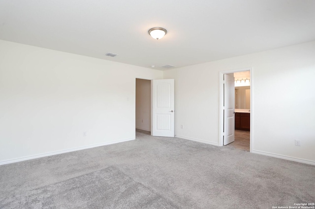 2006 Prometheus Cv, San Antonio, TX 78245 - unfurnished bedroom with light colored carpet, baseboards, and ensuite bathroom