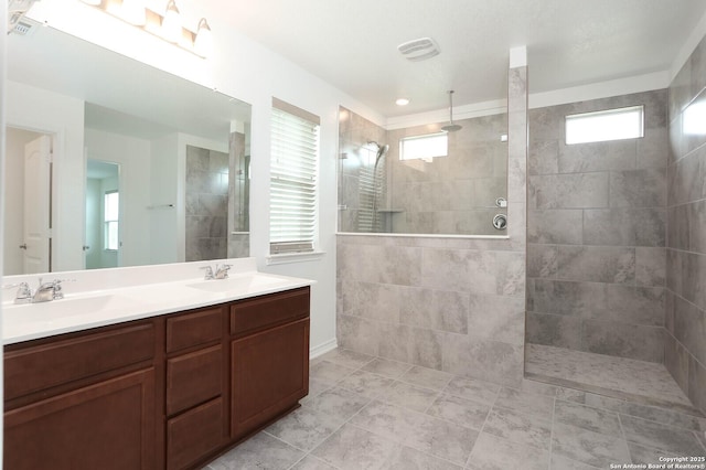 2006 Prometheus Cv, San Antonio, TX 78245 - bathroom with healthy amount of natural light, double vanity, and a walk in shower