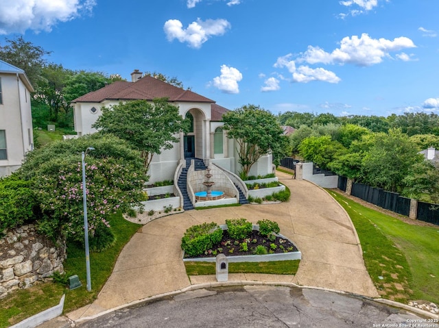 3 Benchwood Cir, San Antonio, TX 78248 - mediterranean / spanish-style house featuring stucco siding and a chimney