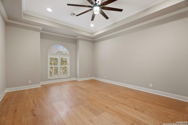 3 Benchwood Cir, San Antonio, TX 78248 - spare room featuring ceiling fan, light wood-style floors, a tray ceiling, baseboards, and ornamental molding