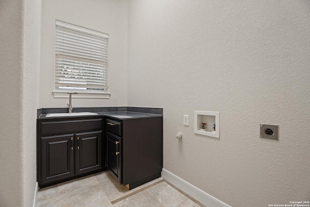 3 Benchwood Cir, San Antonio, TX 78248 - laundry room featuring hookup for a washing machine, hookup for an electric dryer, baseboards, cabinet space, and light tile patterned flooring