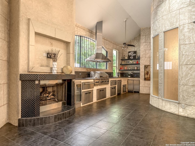 3 Benchwood Cir, San Antonio, TX 78248 - kitchen with island range hood, high vaulted ceiling, a fireplace, a warming drawer, and dark tile patterned flooring