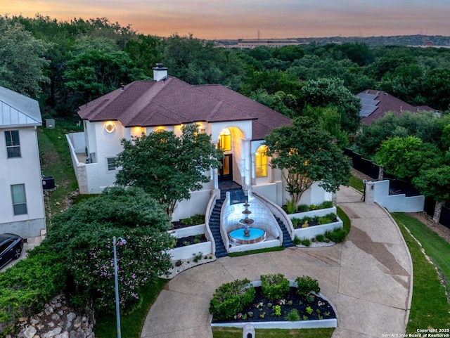 3 Benchwood Cir, San Antonio, TX 78248 - mediterranean / spanish house featuring a chimney and stucco siding