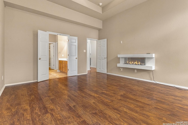 6218 Ozona Ml, San Antonio, TX 78253 - unfurnished living room with a brick fireplace, wood finished floors, baseboards, and a high ceiling