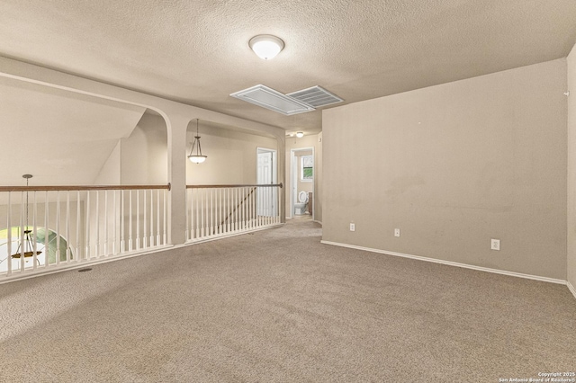 6218 Ozona Ml, San Antonio, TX 78253 - empty room featuring attic access, carpet, a textured ceiling, and baseboards