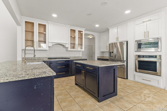 6218 Ozona Ml, San Antonio, TX 78253 - kitchen with appliances with stainless steel finishes, a sink, white cabinetry, light stone counters, and recessed lighting