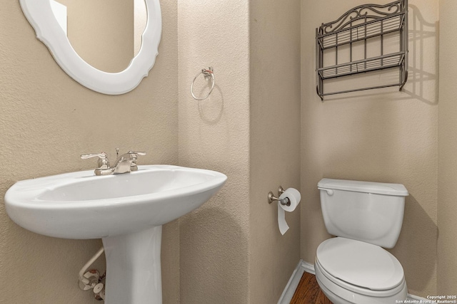 6218 Ozona Ml, San Antonio, TX 78253 - bathroom with toilet, wood finished floors, and a sink