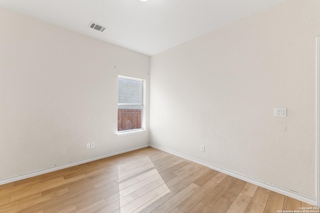 7619 Bit Cir, Elmendorf, TX 78112 - unfurnished room featuring light wood-type flooring and baseboards